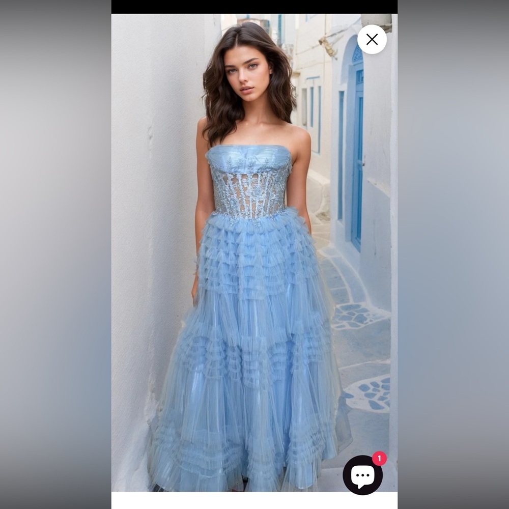 Long strapless blue ruffle prom dress with corset by Dave and Johnny.